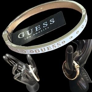 GUESS Logo Polished Gold Tone White Enamel Crystal Detail Hinge Bangle Bracelet